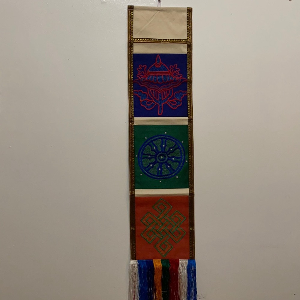 Tibetan wall decorative with auspicious symbols